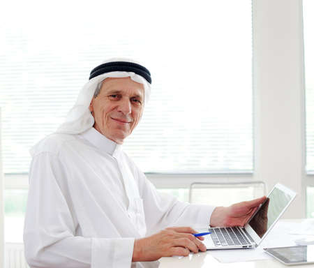 Lifestyle posing elderly senior businessman at officeの写真素材