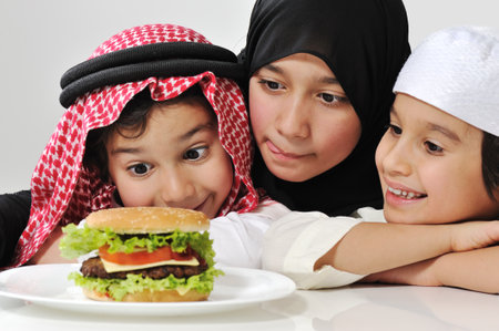 Arabic family children with hamburgerの写真素材