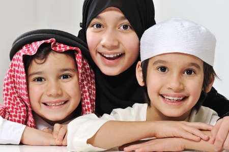 Little Muslim Arabic girl and two boys portraitの写真素材