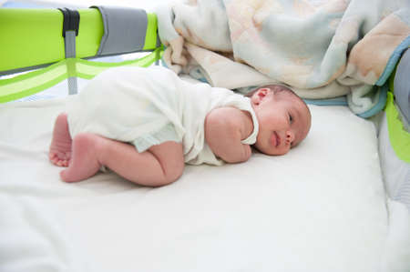 Newborn baby in bed , high quality photo