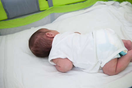 Newborn baby in bed , high quality photo