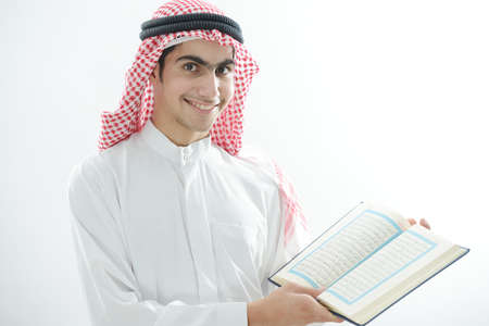 Arabic kid with Koran , high quality photoの写真素材
