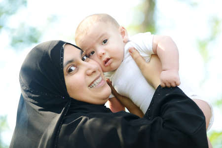 Mother and her baby enjoying in natureの写真素材
