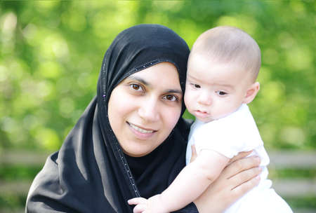 Mother and her baby enjoying in natureの写真素材