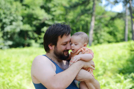 Father and his baby enjoying in natureの写真素材