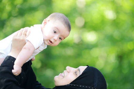 Mother and her baby enjoying in natureの写真素材