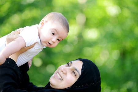 Mother and her baby enjoying in natureの写真素材