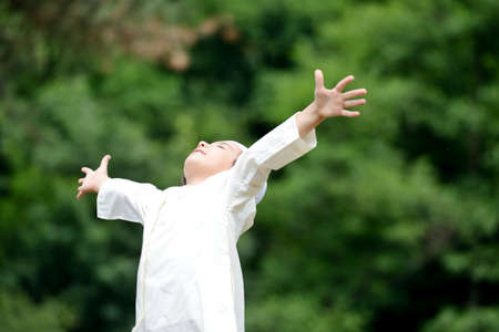 Little Arabic boy enjoying fresh air in nature