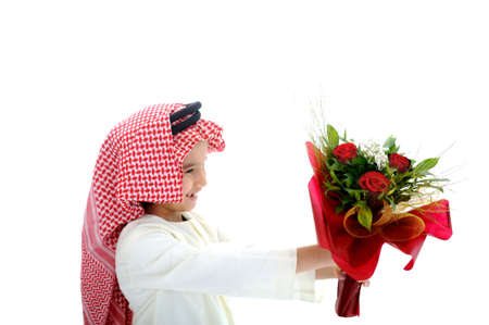 Saudi Arabian kid with bouquet of flowersの写真素材