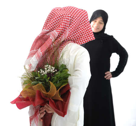 Arabian couple, roses and flowers as surpriseの写真素材