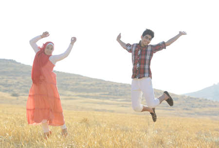 Arabic people enjoying on beautiful meadowの写真素材