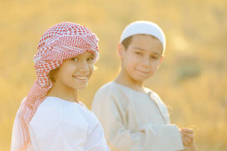 Kids on wheat fieldの写真素材