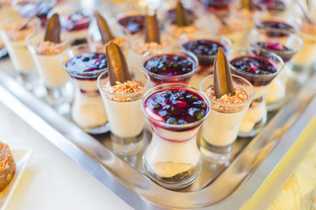 Beautifully decorated catering banquet table with different food snacksの写真素材