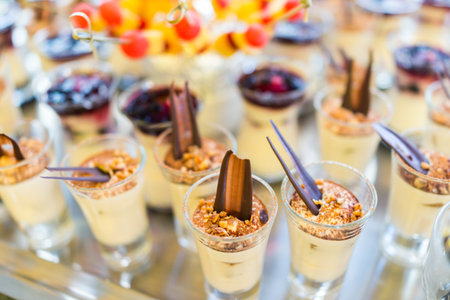Beautifully decorated catering banquet table with different food snacksの写真素材