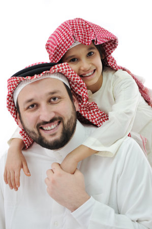 Arabic family, father piggybacking sonの写真素材