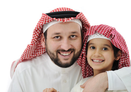 Arabian son and his father wearing keffiyehの写真素材