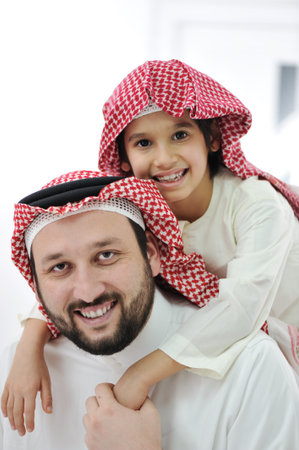 Adult and child with middle eastern clothesの写真素材