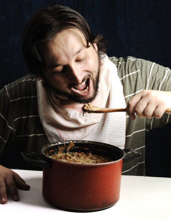 Man eating at home relaxing resting. High quality photoの写真素材