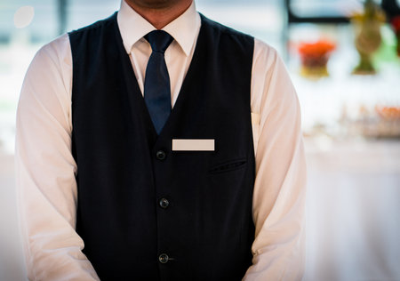 Young waiter at the restaurantの写真素材