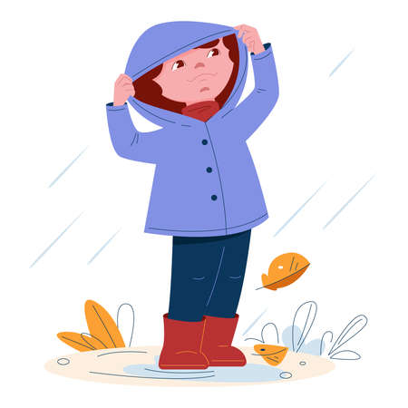 Cute little girl in a raincoat with a hood in rubber boots in the rain. Vector illustration in cartoon style.のイラスト素材