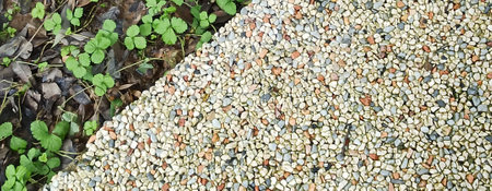 the path is the texture of stone and grass. close-up. background image Straight line of stone...