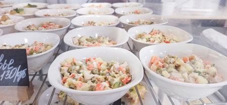 Fresh vegetable dishes arranged in bowls at a local market in the afternoonの写真素材