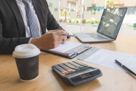 Apply for a job with a resume and search for qualified employees to screen jobs on a computer desk.の写真素材
