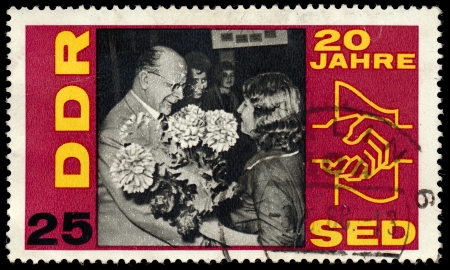 GERMAN DEMOCRATIC REPUBLIC - CIRCA 1966  A stamp printed in Germany shows the 20 years Socialist Unity Party of Germany, circa 1966 のeditorial素材
