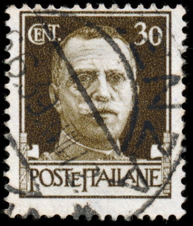 ITALY - CIRCA 1943  Stamps printed in Italy shows image of King Victor Emmanuel III of Italy, circa 1943 のeditorial素材