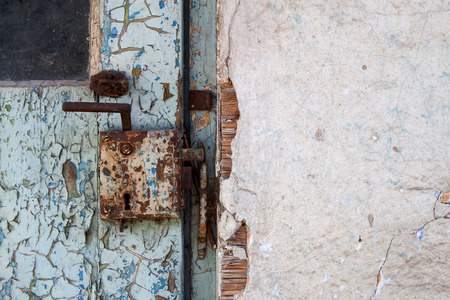 old wooden door with metal lock detailの写真素材