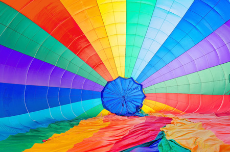A background with an abstract view of a colorful parachute.の写真素材