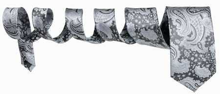 Brown leather men's tie in form of spiral hung in the airの写真素材