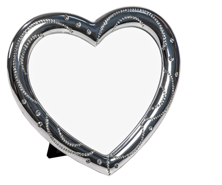 Metal photo frame inlaid with rhinestones in form of heart with place isolated for your photo.の写真素材