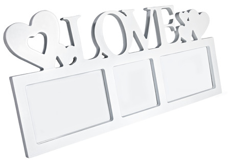 Blank rectangular photo frame standing at an angle with hearts and text Love. Ready for your photo or message on Valentine's Dayの写真素材