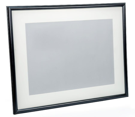 Black photo frame rotated in a plane isolated on white backgroundの写真素材
