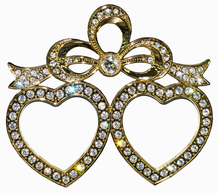 Gilded photo frame inlaid with rhinestones in form of hearts with place isolated for your photo.の写真素材