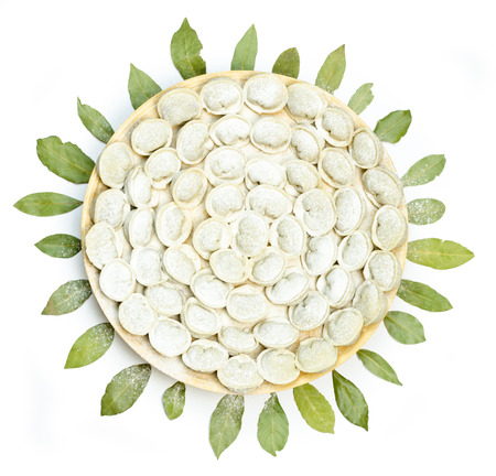 Meat dumplings - russian pelmeni on white isolated background. Top viewの写真素材