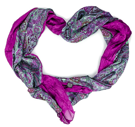 Women's purple silk scarf in form of heart on isolated backgroundの写真素材