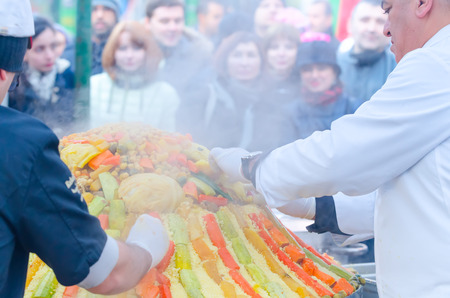 Moscow, Russia - November 11, 2015: Chefs from Morocco prepare a large couscous on the street. Festival of Morocco in Moscow.のeditorial素材