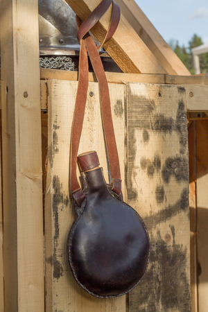 Brown leather flask isolated on white backgroundの写真素材