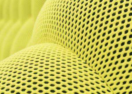 The colored yellow abstract background mesh checkered. Light green nylon texture designed as net streamlineの写真素材