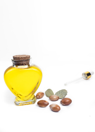 Argan oil. Bottle with oil. Cosmetic means. Food product. Jar with argan oil on the isolated background.の写真素材