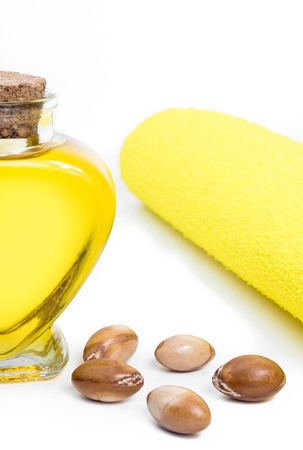 Argan oil. Bottle with oil. Cosmetic means. Food product. Jar with argan oil on the isolated background.の写真素材