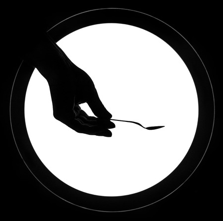 Hand giving spoon two fingers sign gesture isolated over white round background.の写真素材