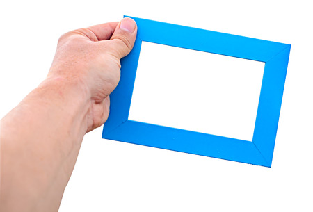 A male hand hold a empty blue photo frame isolated white