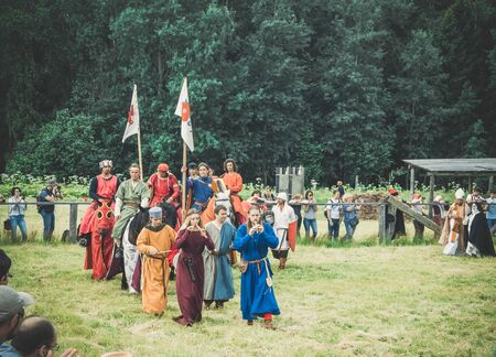 RITTER WEG, MOROZOVO, APRIL 2017: Procession of the festival participants. Reconstruction roleplay festival. People in authentic historical clothing at medieval feast. Festival of the European Middle Agesのeditorial素材