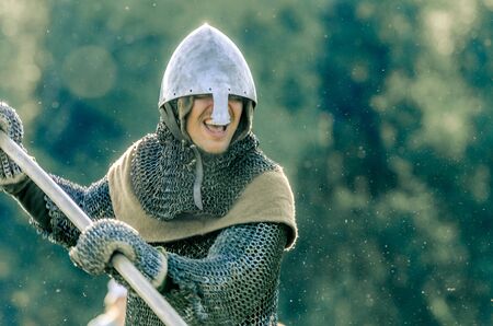 RITTER WEG, MOROZOVO, APRIL 2017: Knight goes on attack with a spear in his hands. Attack of powerful knight in heavy armorのeditorial素材