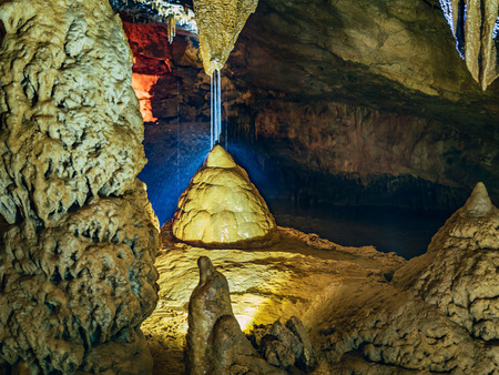 Wonderful Prometheus Cave. Stalactites and stalagmites in the illuminated caveの写真素材