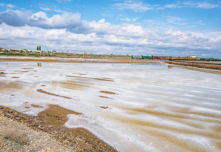 Shores of the salar Baskunchak. Extraction of salt.The ground is crusted with salt