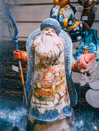 MOSCOW, Russia - December 19, 2018: Figurine of Father Frost Santa Claus Ded Moroz on the shop window Christmas Market in Red Square, Moscow. Sale of toys, famous and popular fairy-tale characters, figurinesのeditorial素材